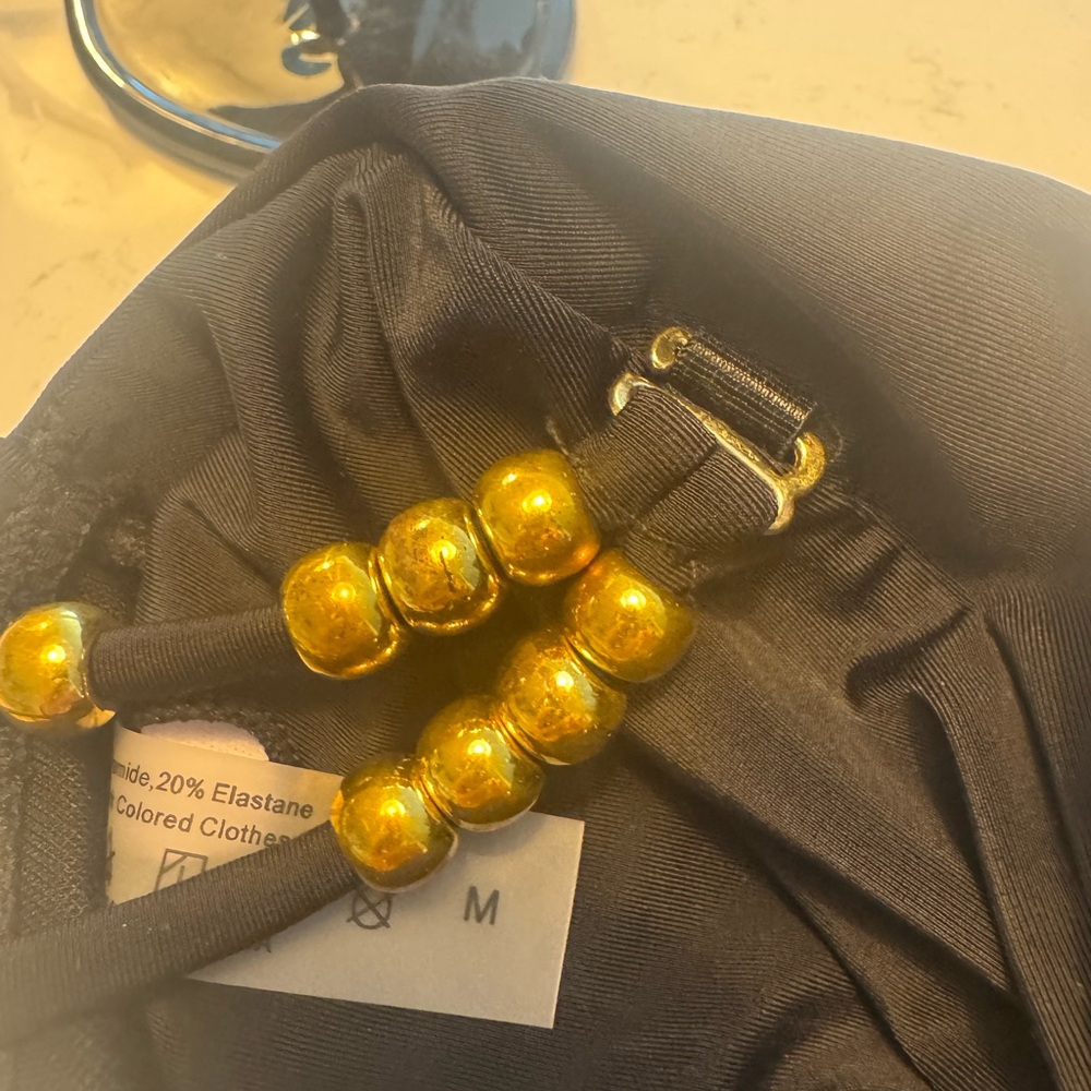Black One-Piece Swimsuit with Gold Accents and cutouts - Picture 10 of 10